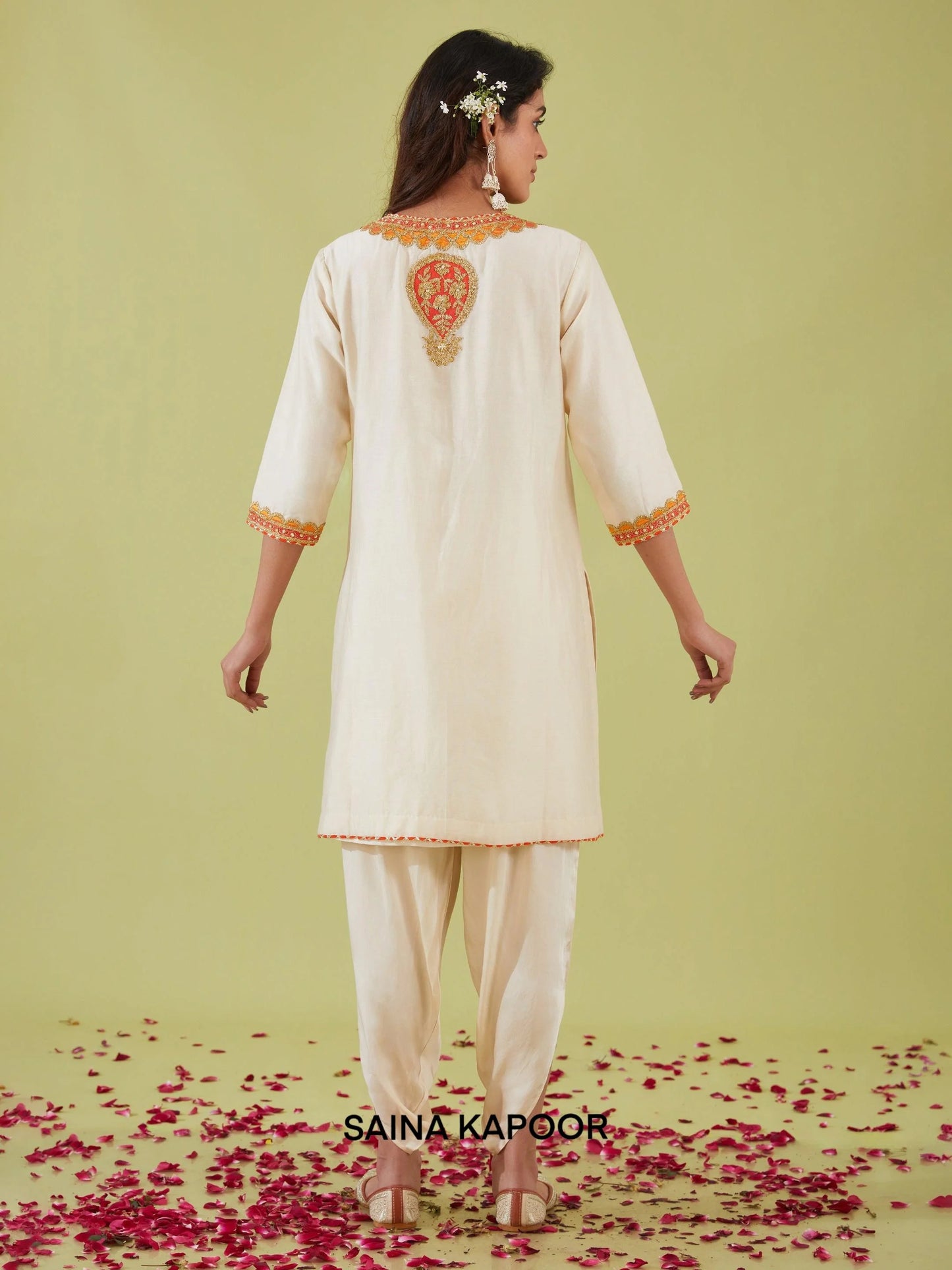 Back view of ivory Bamber Satin A-line kurta with samosa pants — designer ethnic wear — Saina Kapoor