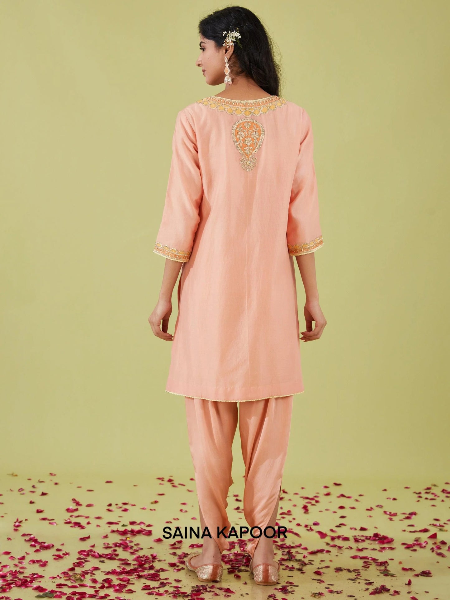 Back view of peach pink Bamber Satin A-line kurta with samosa pants — designer ethnic wear — Saina Kapoor