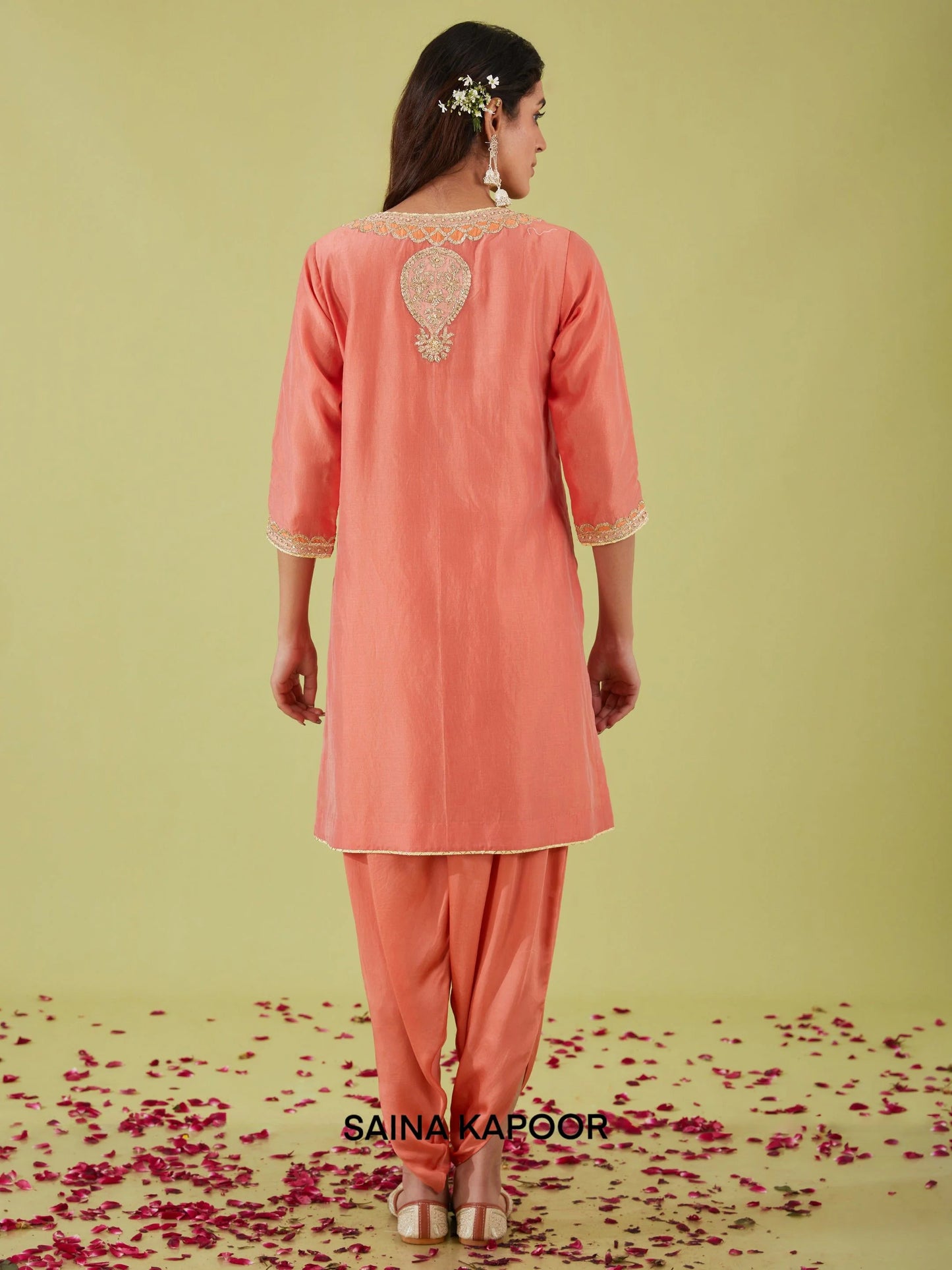 Back view of rust pink Bamber Satin A-line kurta with samosa pants — designer ethnic wear — Saina Kapoor