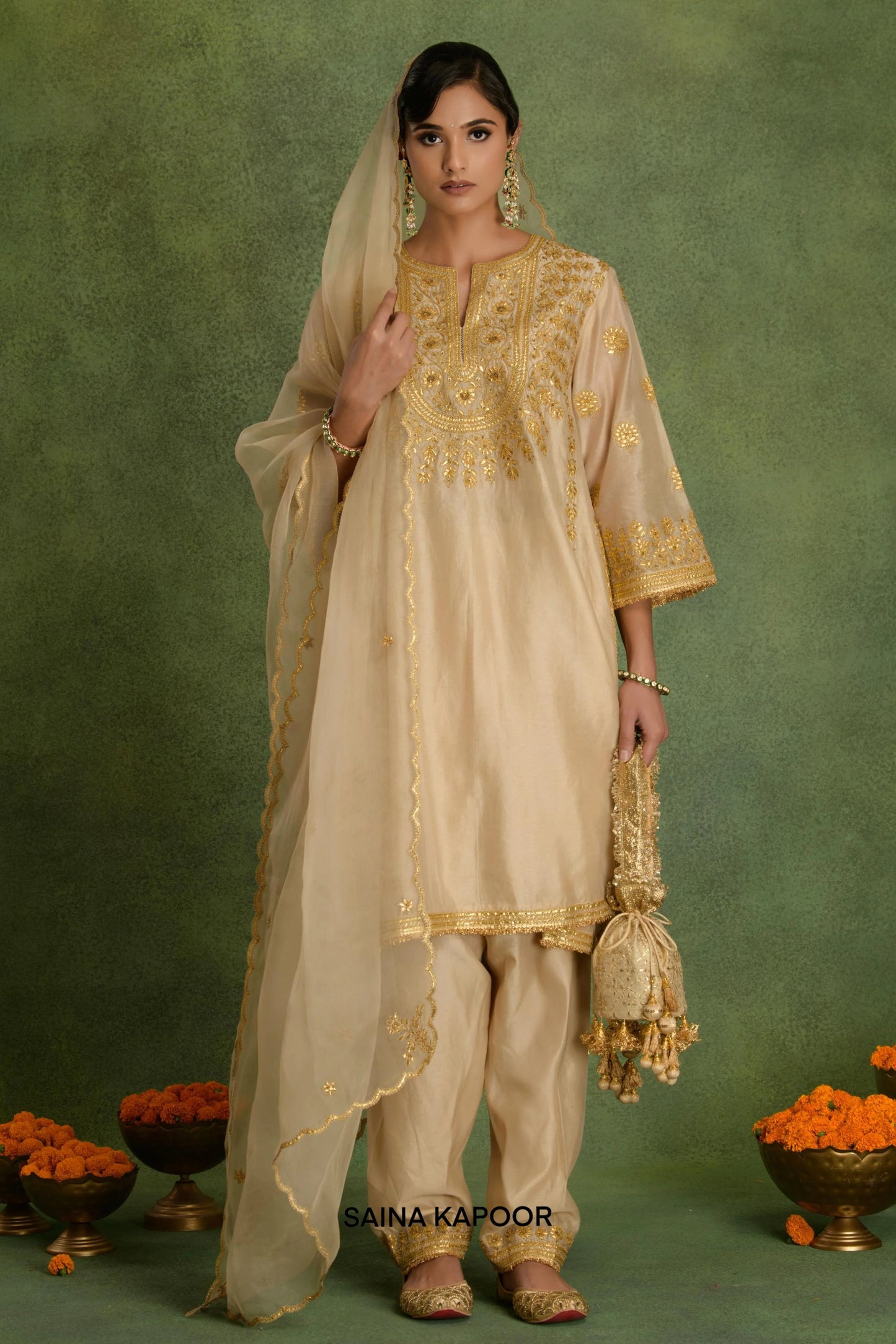 Beige Chanderi long Choga style kurta salwar set with organza dupatta by Saina Kapoor front view