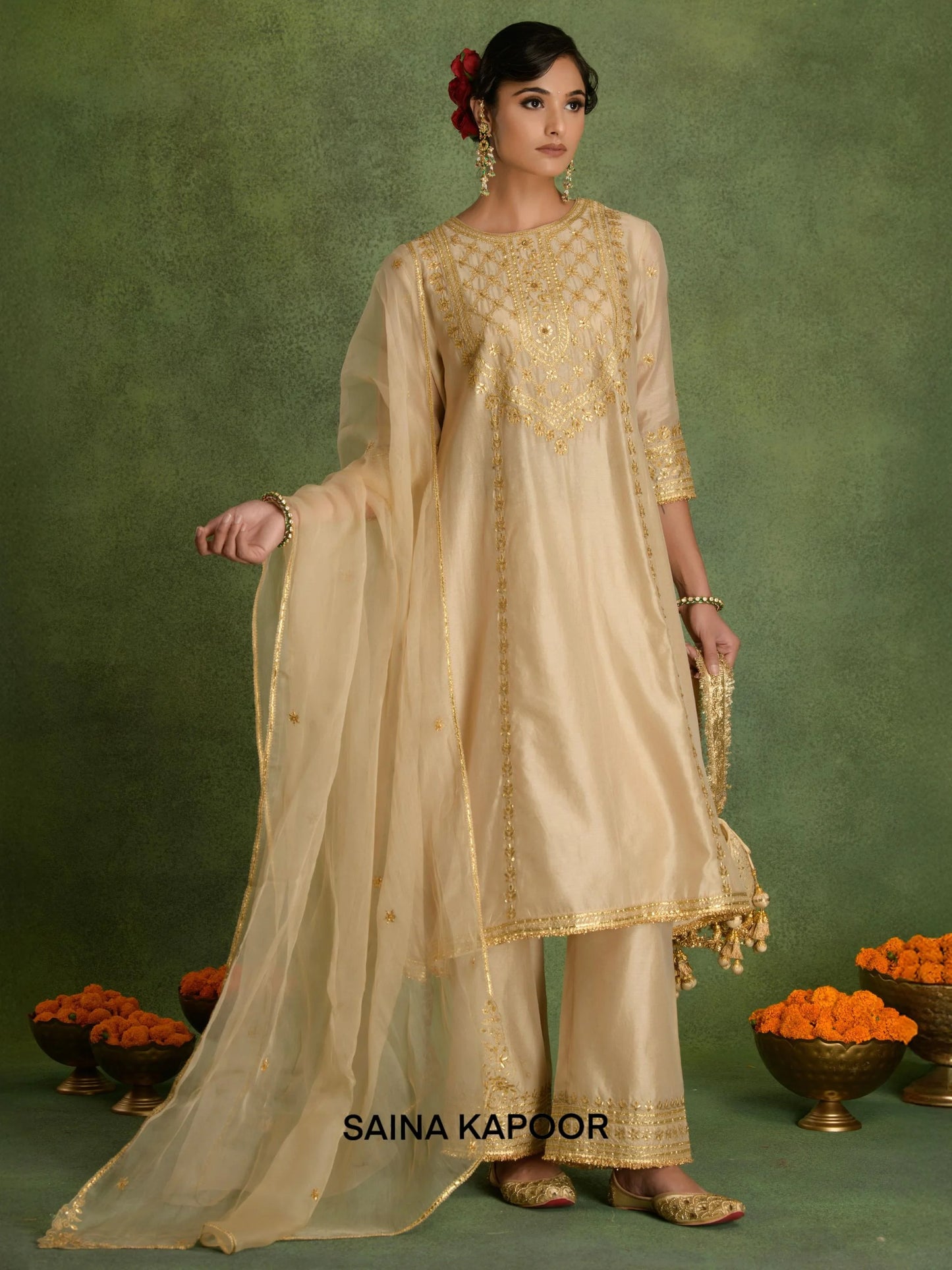 Beige Chanderi long A-line kurta DHRUVIKA with gold gota patti sequin embroidered sheer yoke & matching palazzo pants, organza dupatta & embroidered potli bag — Saina Kapoor