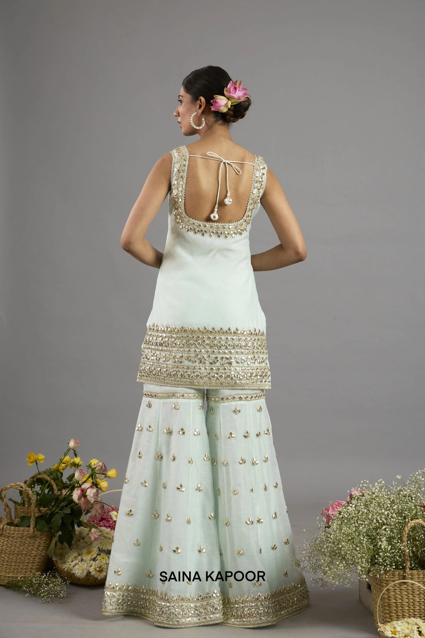 Abeeda kurta back view with sleeveless square neckline bordered in gota patti embroidery and tasseled tie closure - Saina Kapoor