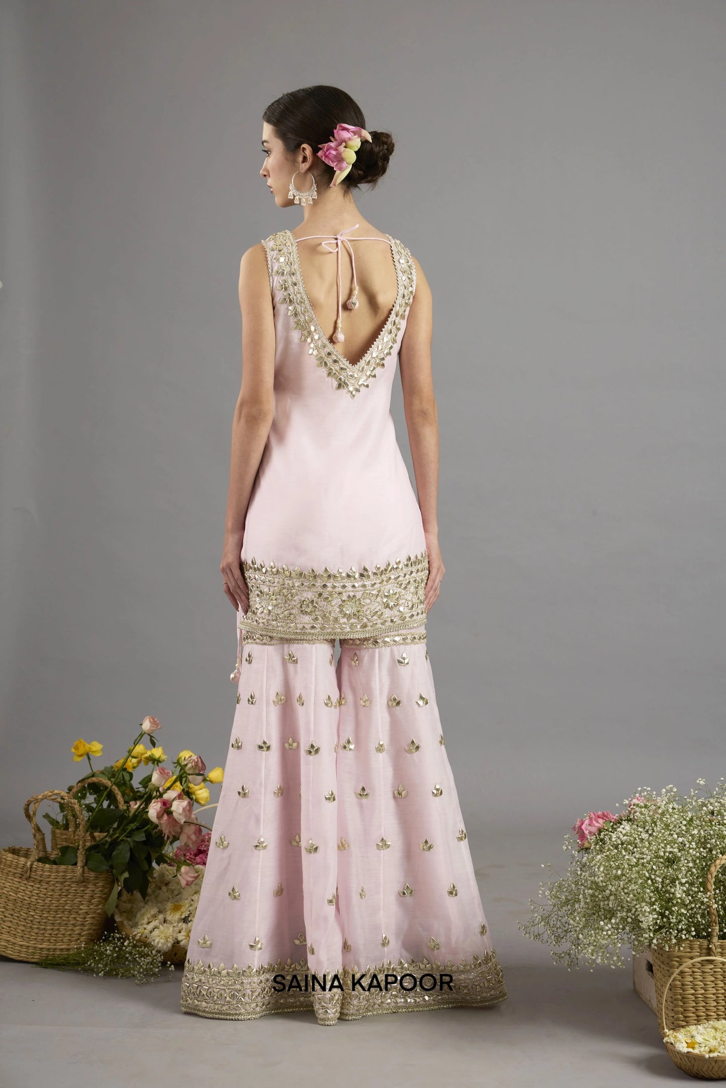 Areej kurta back view with sleeveless V-neckline bordered in gota patti embroidery and tasseled tie closure - Saina Kapoor