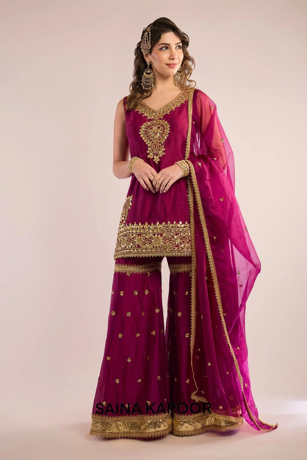 Magenta Chanderi sleeveless kurti with gota patti embroidered V-neckline & matching gharara & magenta organza dupatta — Saina Kapoor