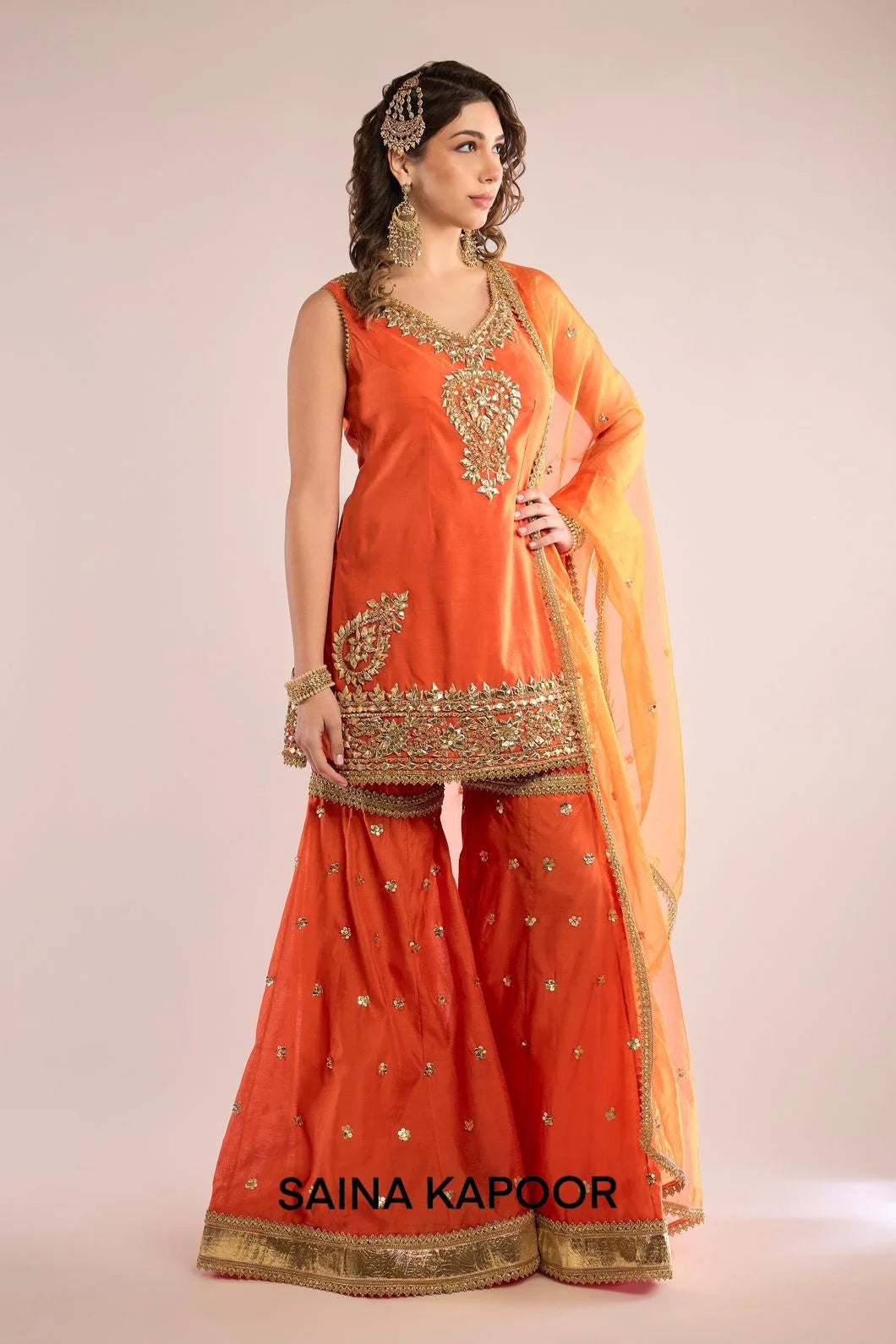Orange Chanderi sleeveless kurti with gota patti embroidered V-neckline & matching gharara & orange organza dupatta — Saina Kapoor