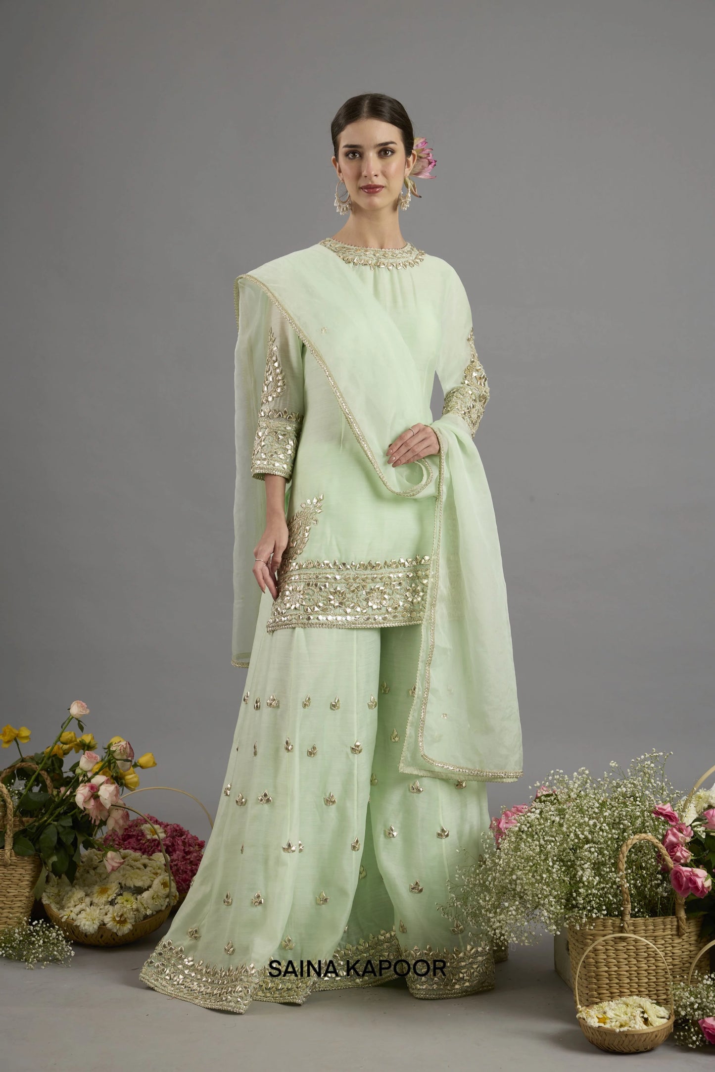 Aseelah mint green Chanderi kurta with gota patti round neckline paired with matching flared sharara and organza dupatta - Saina Kapoor