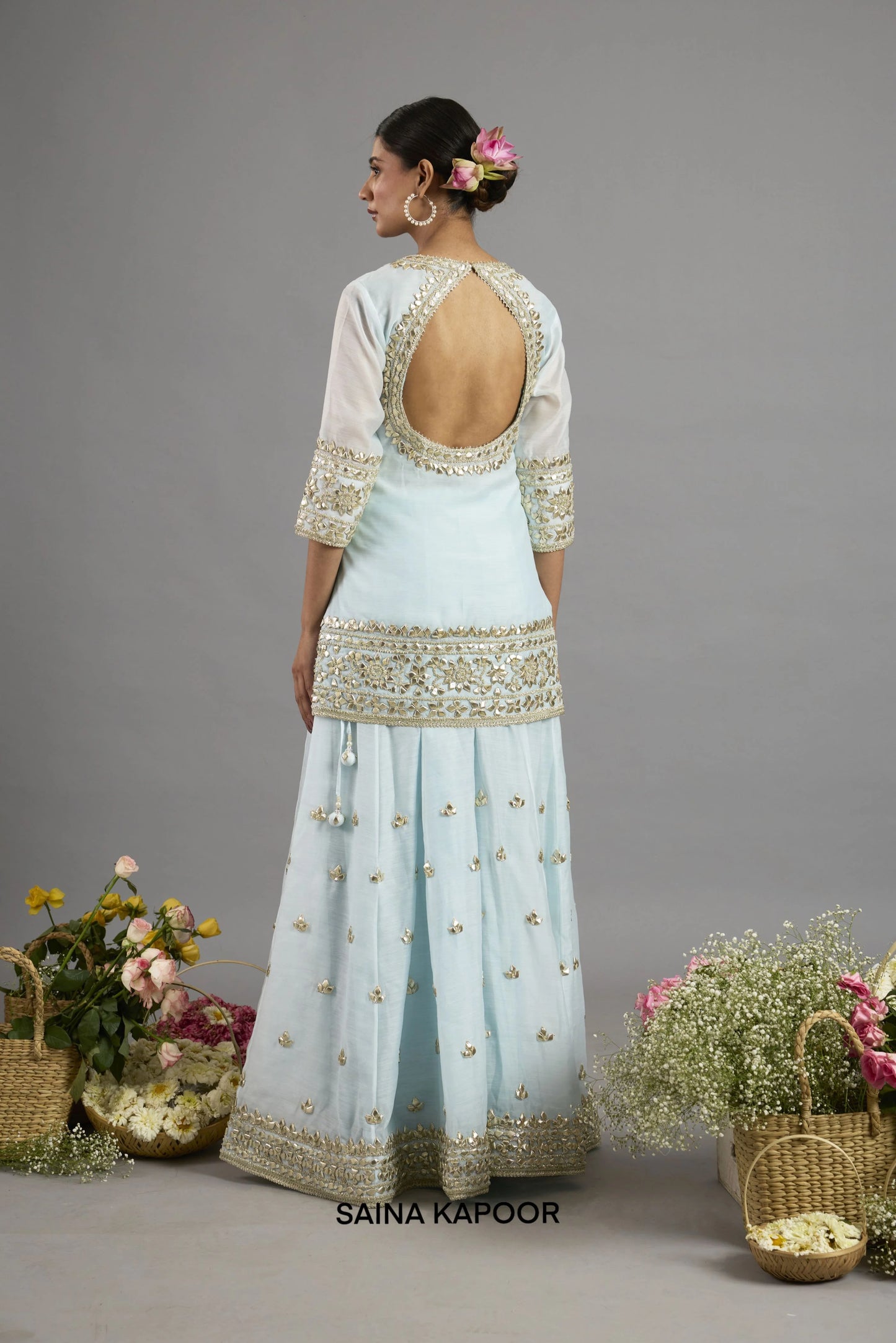 Ice blue kurta back view with teardrop keyhole cutback bordered in gota patti embroidery - Saina Kapoor