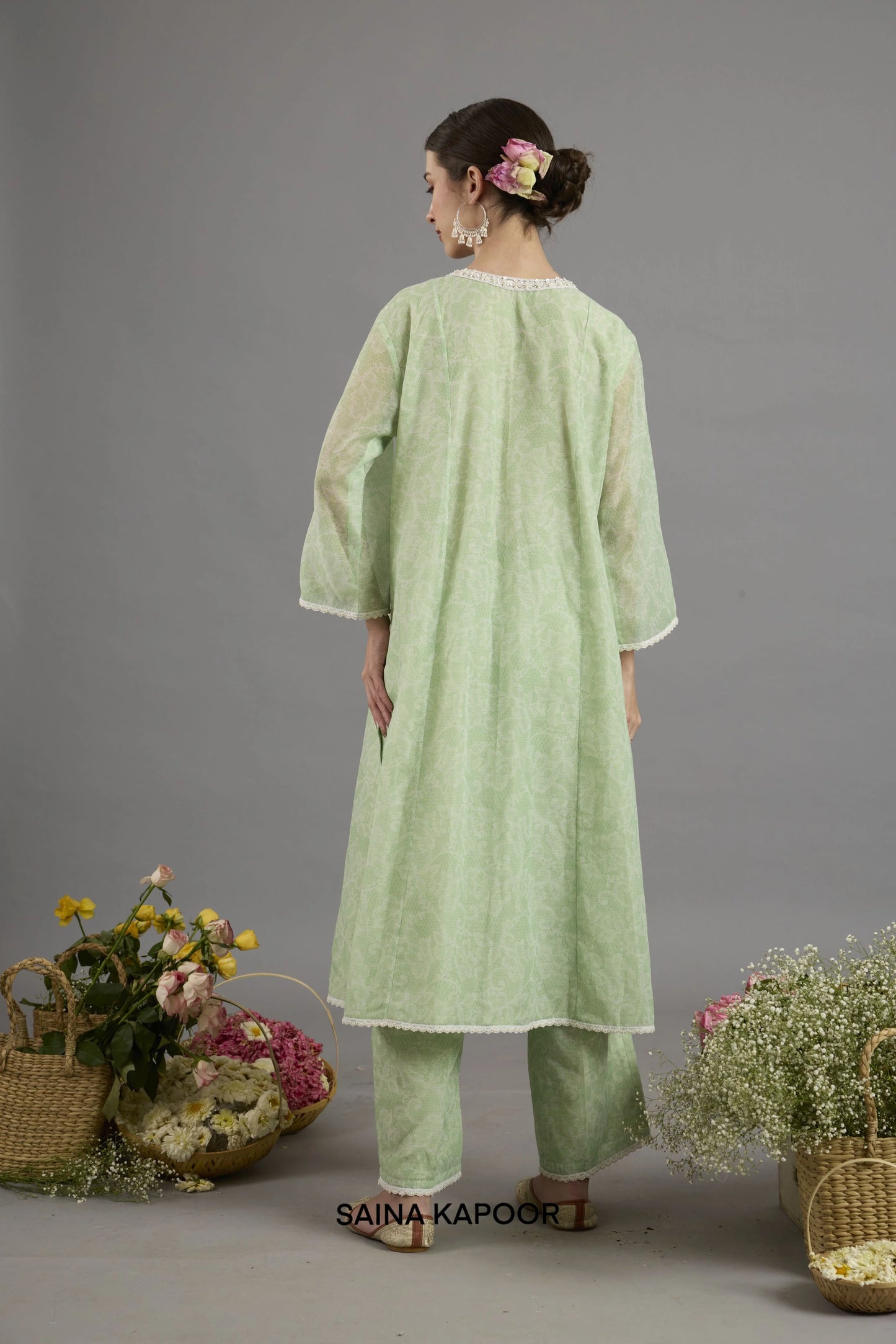 Green Chanderi kurta back view with round neckline bordered in lace and floral-printed fabric detailing - Saina Kapoor