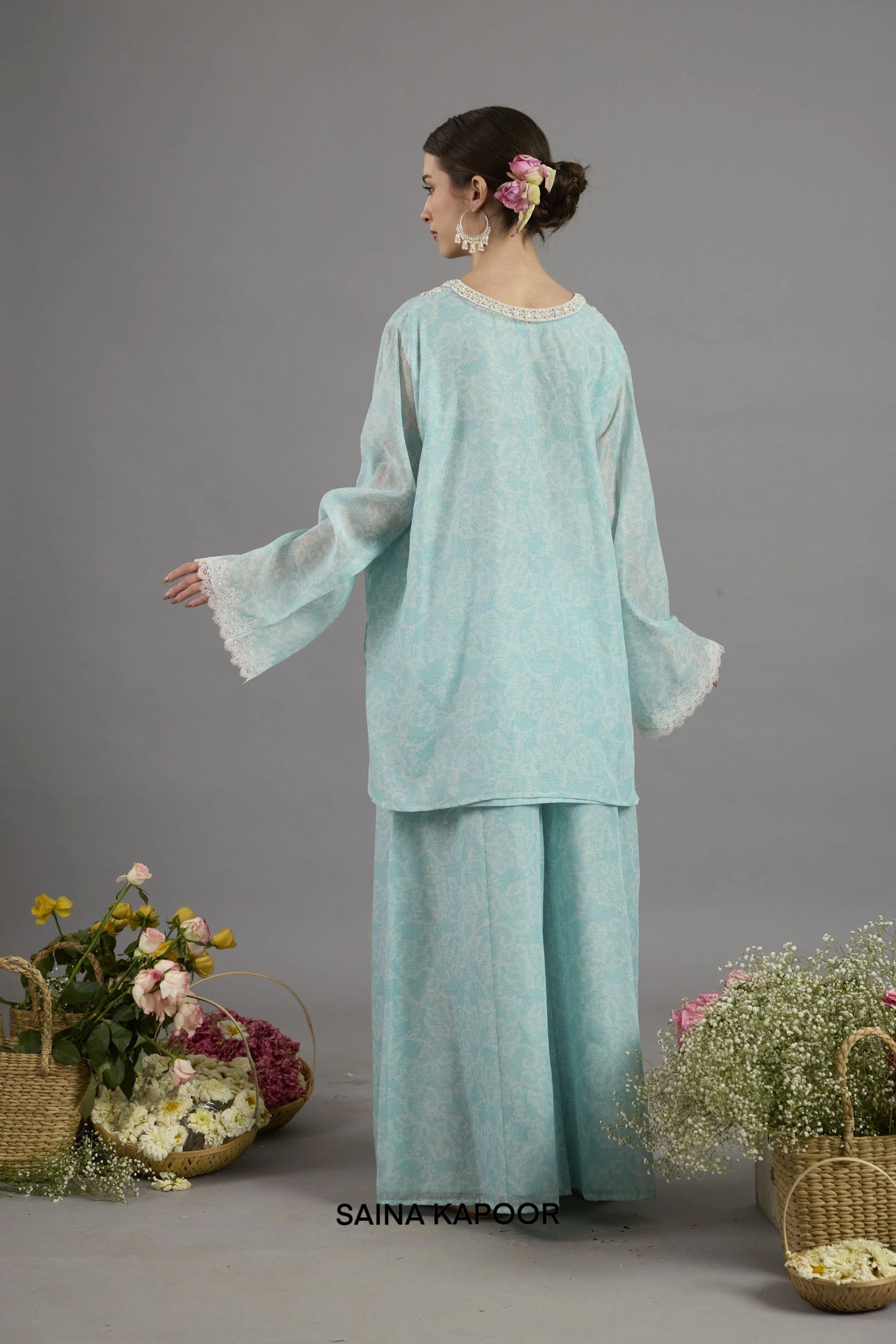 Firoza Chanderi kurta back view with round neckline bordered in lace and floral-printed fabric detailing - Saina Kapoor