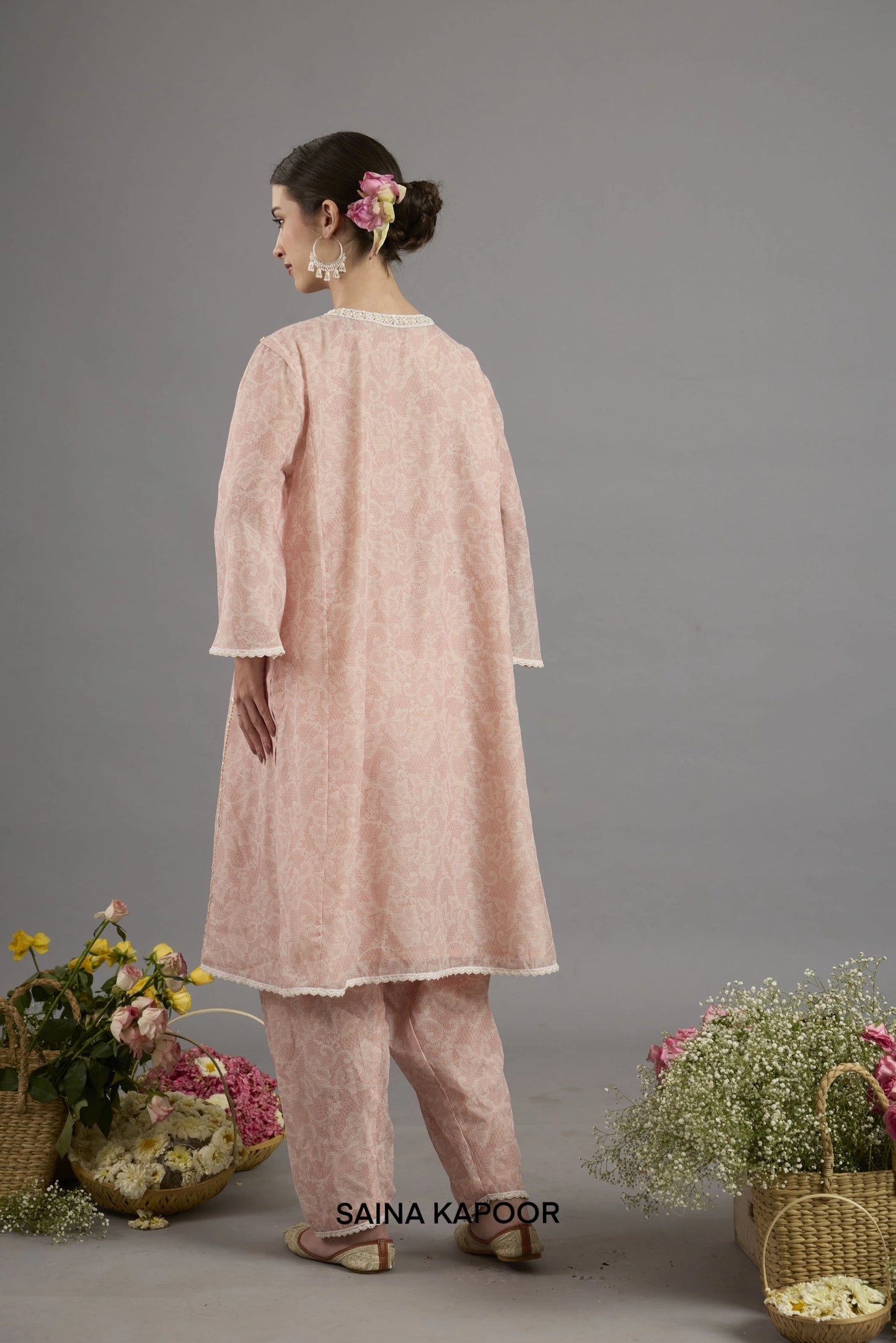 Back view of pink Chanderi printed kurta salwar set showcasing printed fabric and elegant silhouette by Saina Kapoor