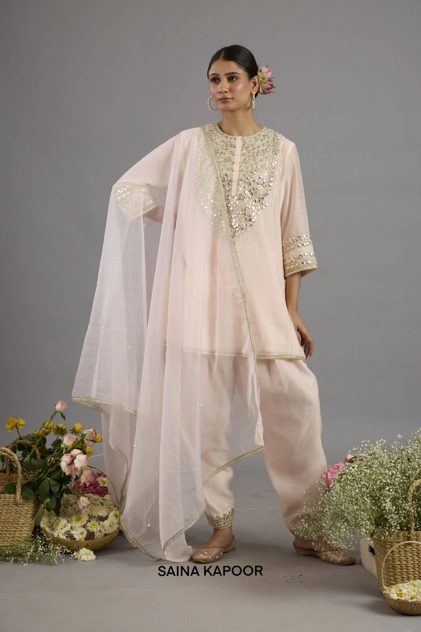 Aiza Peach Pink Chanderi short kurta salwar suit with Gota Patti embroidered yoke, matching salwar and organza dupatta - Saina Kapoor