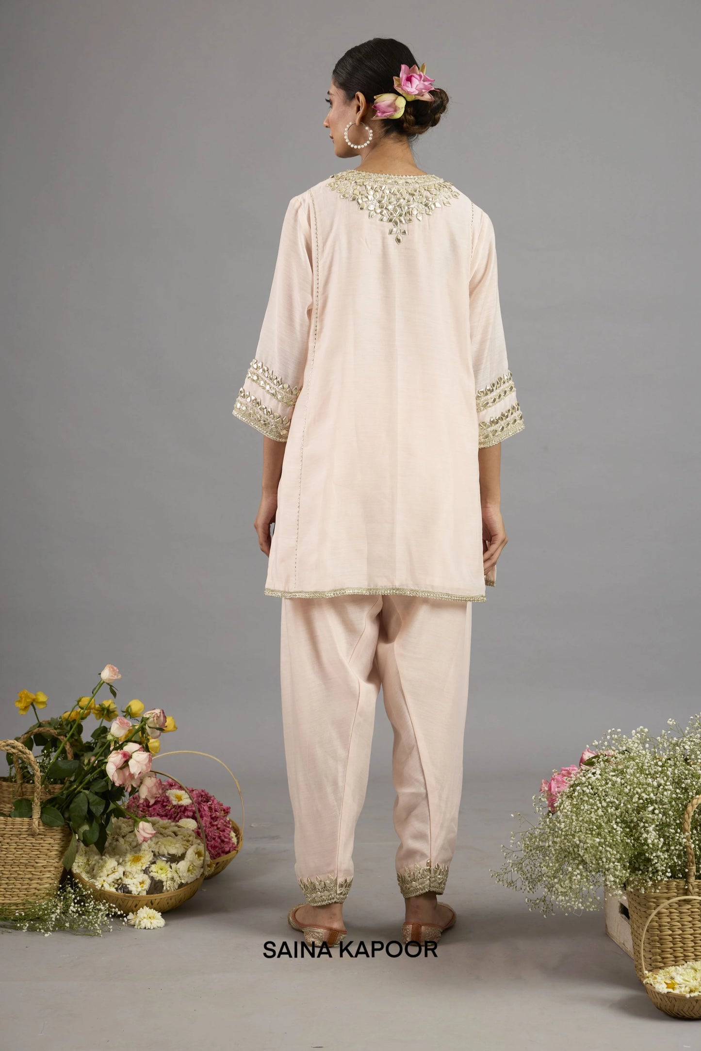 Aiza Peach Pink Chanderi short kurta back view with Gota Patti embroidered neckline, three-quarter sleeves and matching salwar - Saina Kapoor