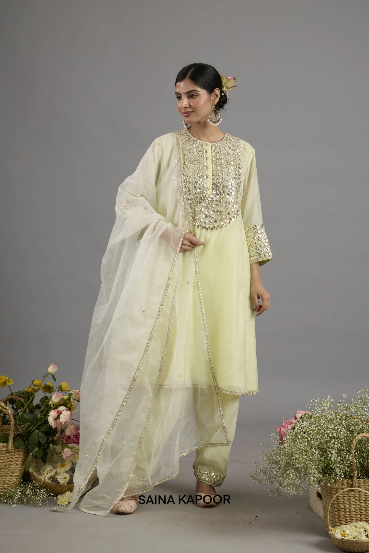 Alia yellow Chanderi A-line kurta with Gota Patti embroidered yoke paired with matching salwar and organza dupatta - Saina Kapoor