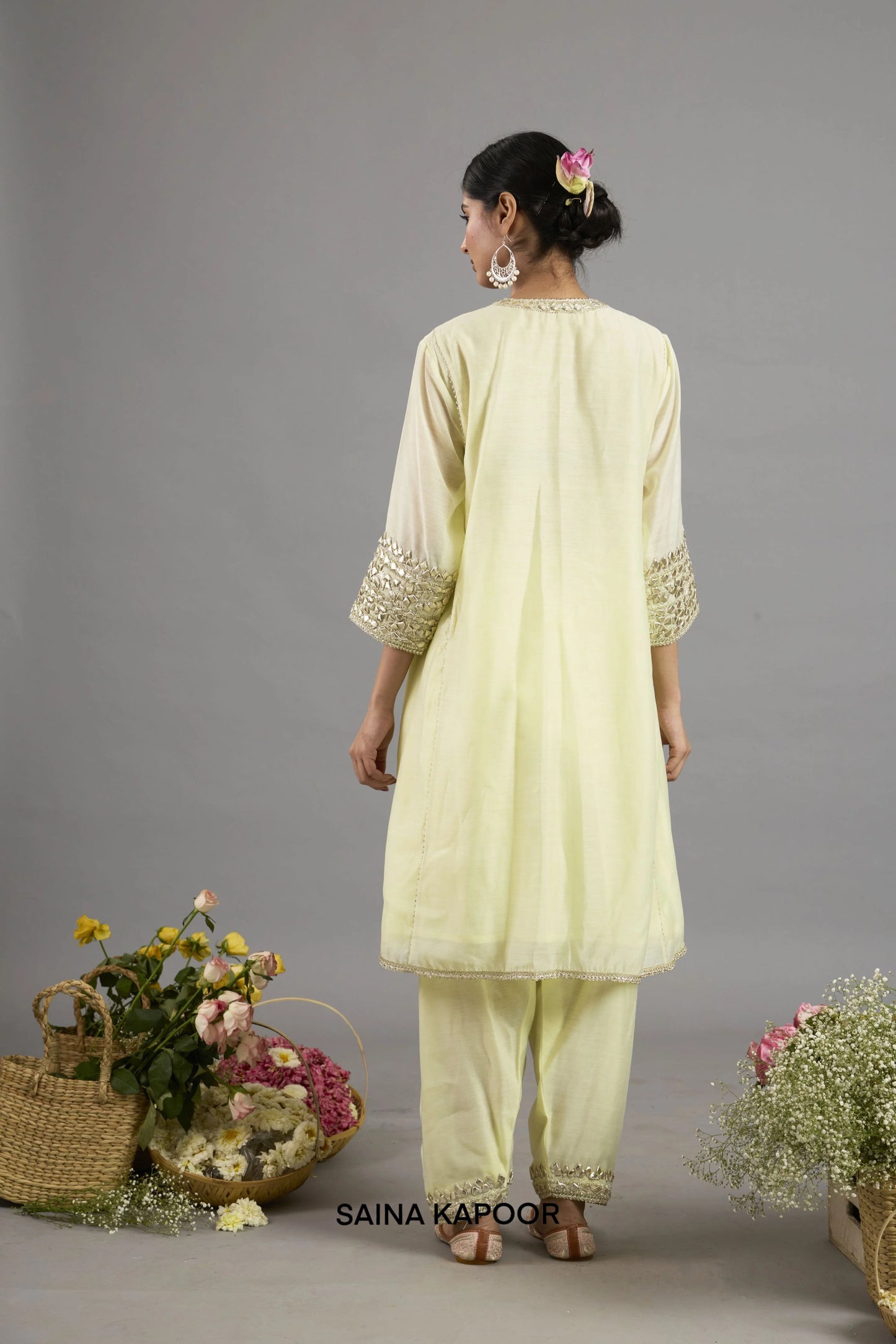Alia yellow Chanderi A-line kurta back view with embroidered neckline, three-quarter sleeves with Gota Patti cuffs and matching salwar - Saina Kapoor