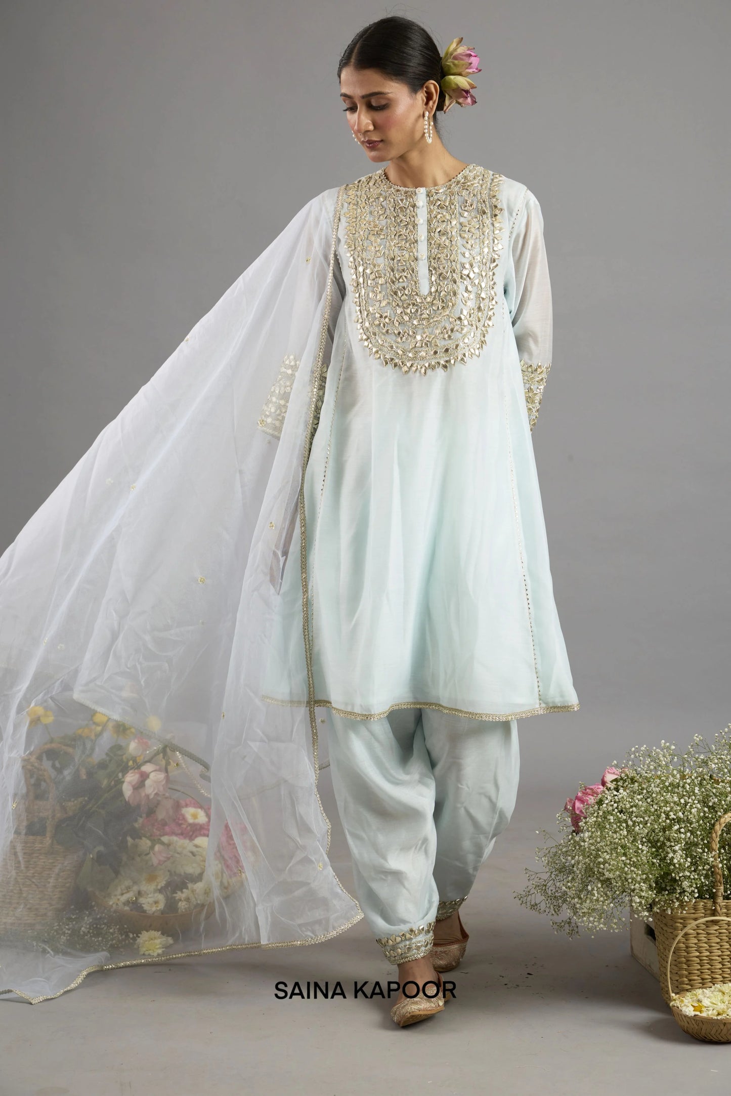 Amira ice blue Chanderi A-line kurta with Gota Patti embroidered yoke paired with matching salwar and organza dupatta - Saina Kapoor
