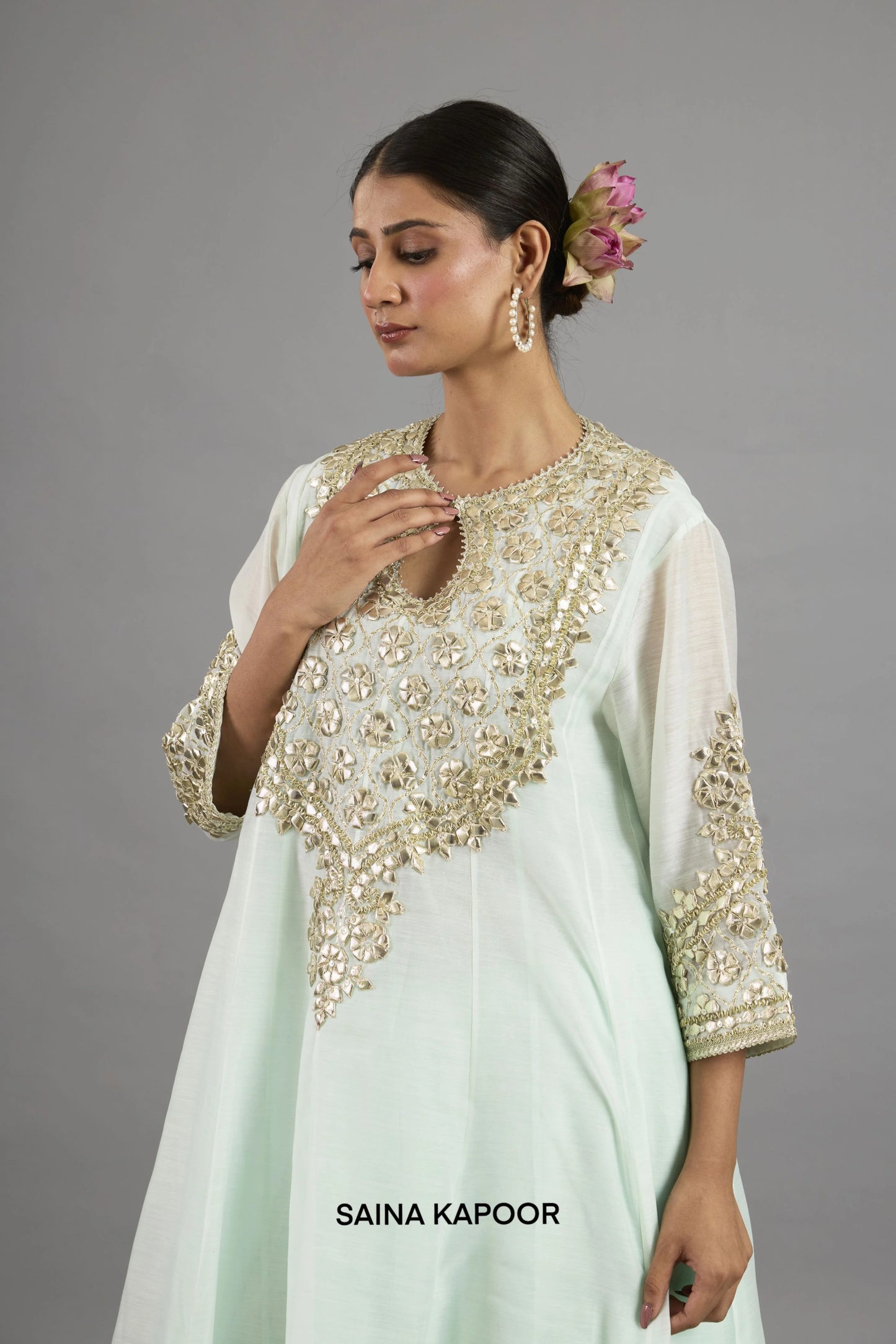 Close-up of gota patti embroidered floral medallion yoke and button placket on Alayna mint green Chanderi Anarkali - Saina Kapoor