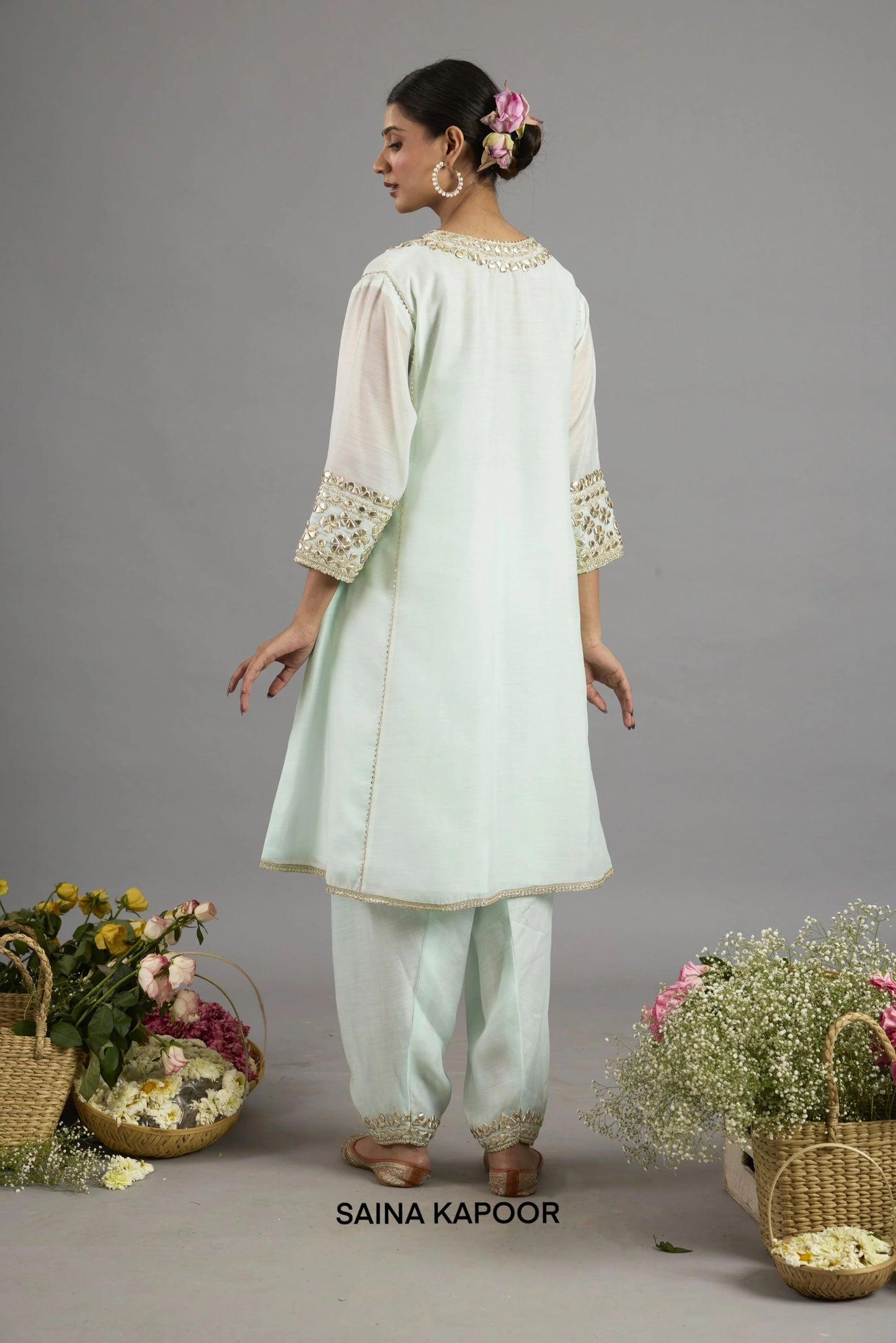 Asma mint green Chanderi kurta back view with round neckline bordered in gota patti embroidery, three-quarter sleeves with embroidered cuffs, and matching salwar - Saina Kapoor
