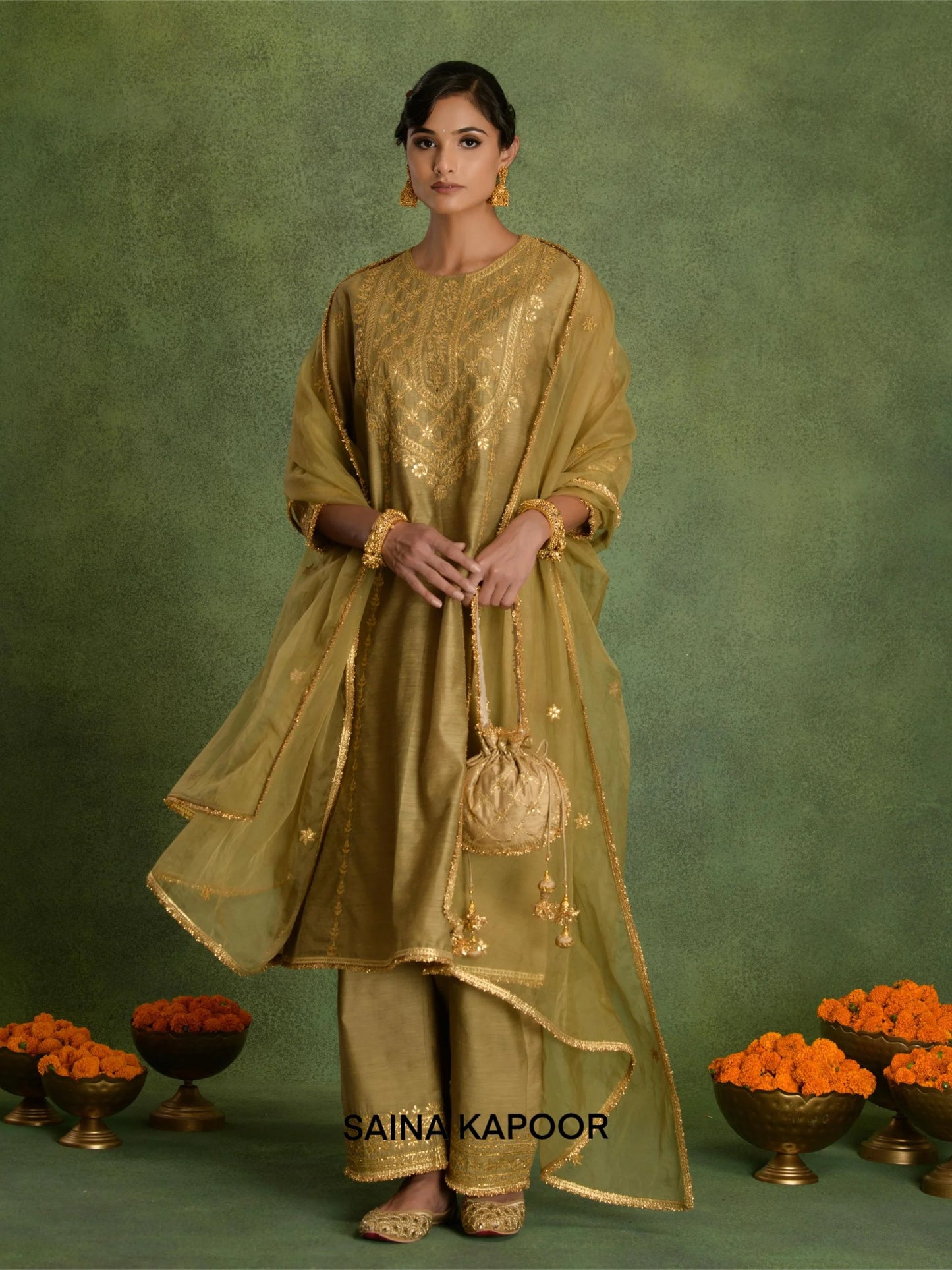 Deep Beige Chanderi long kurta salwar set with organza dupatta and potli by Saina Kapoor front view