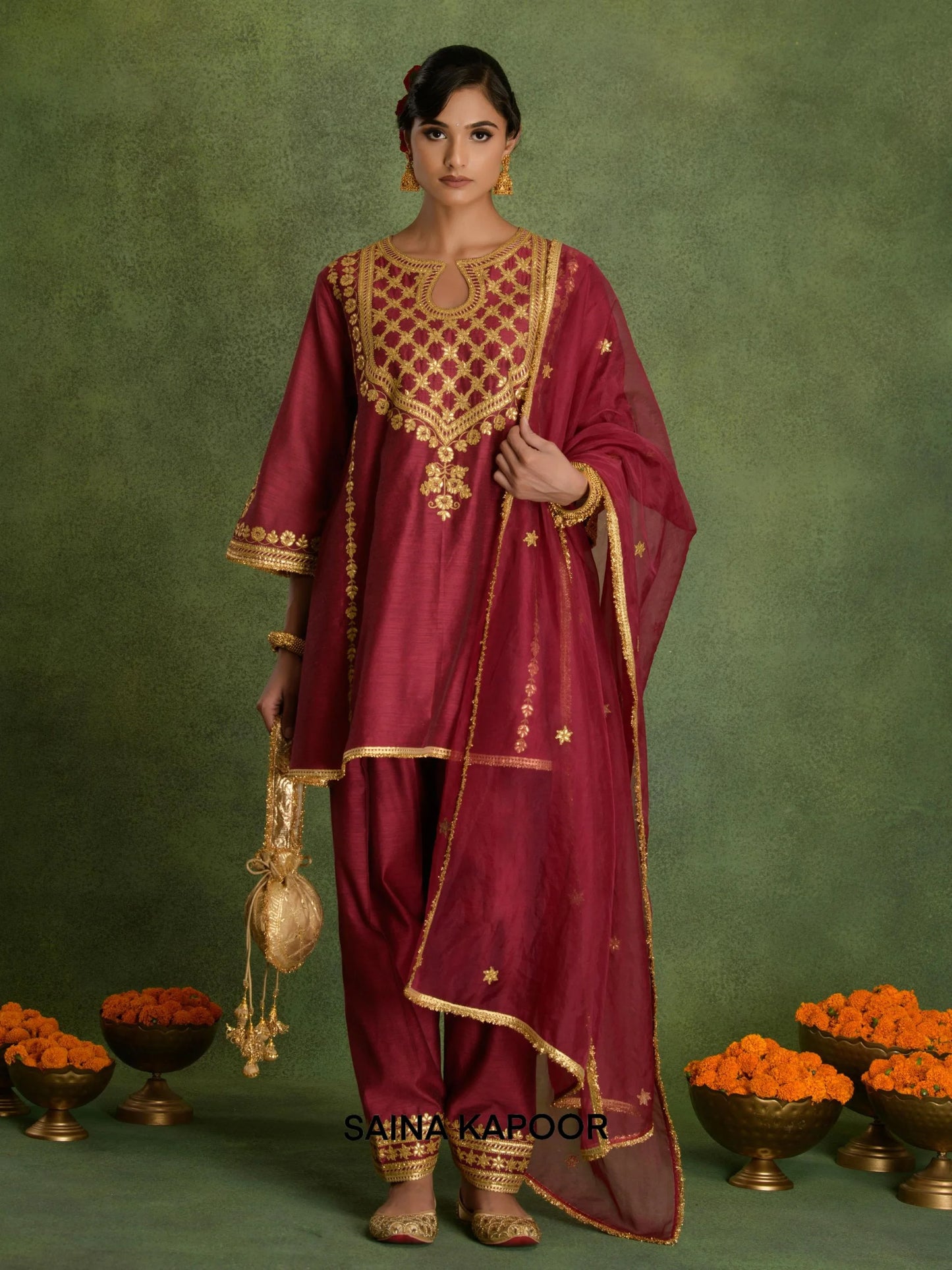 Royal Purple Chanderi short Choga kurta salwar set with organza dupatta and potli by Saina Kapoor front view