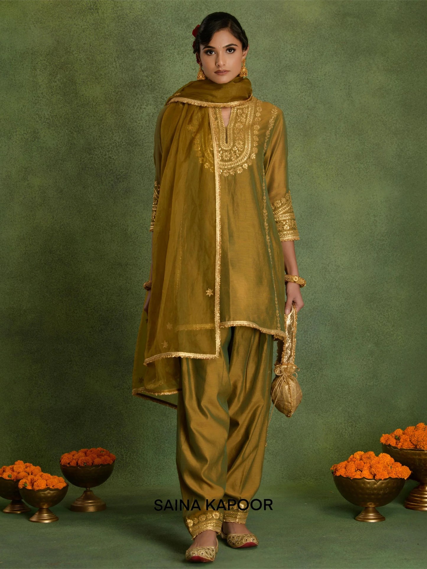 Russian Olive Chanderi short kurta salwar set with organza dupatta and potli by Saina Kapoor front view