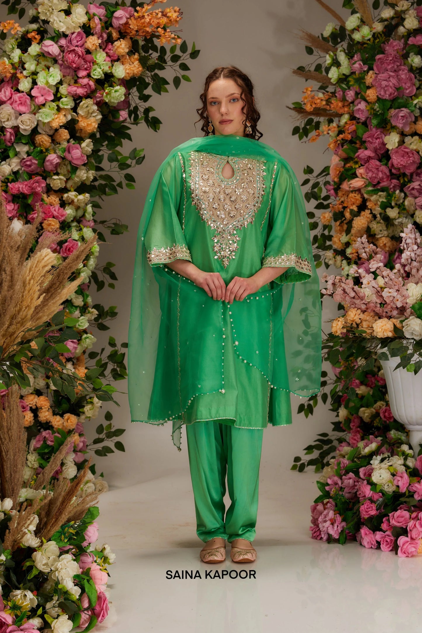 Front angle of mint green Chanderi kurta set for women with keyhole neckline & gota embroidered golden yoke & matching dupatta — Saina Kapoor