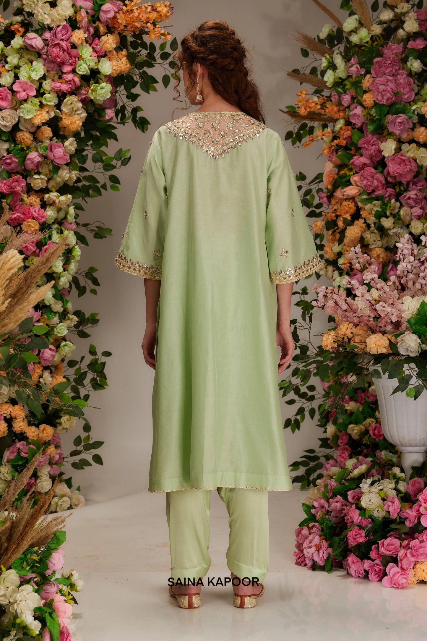 Back view of pista green Chanderi long kurta set for women with draped pista green organza dupatta — Saina Kapoor