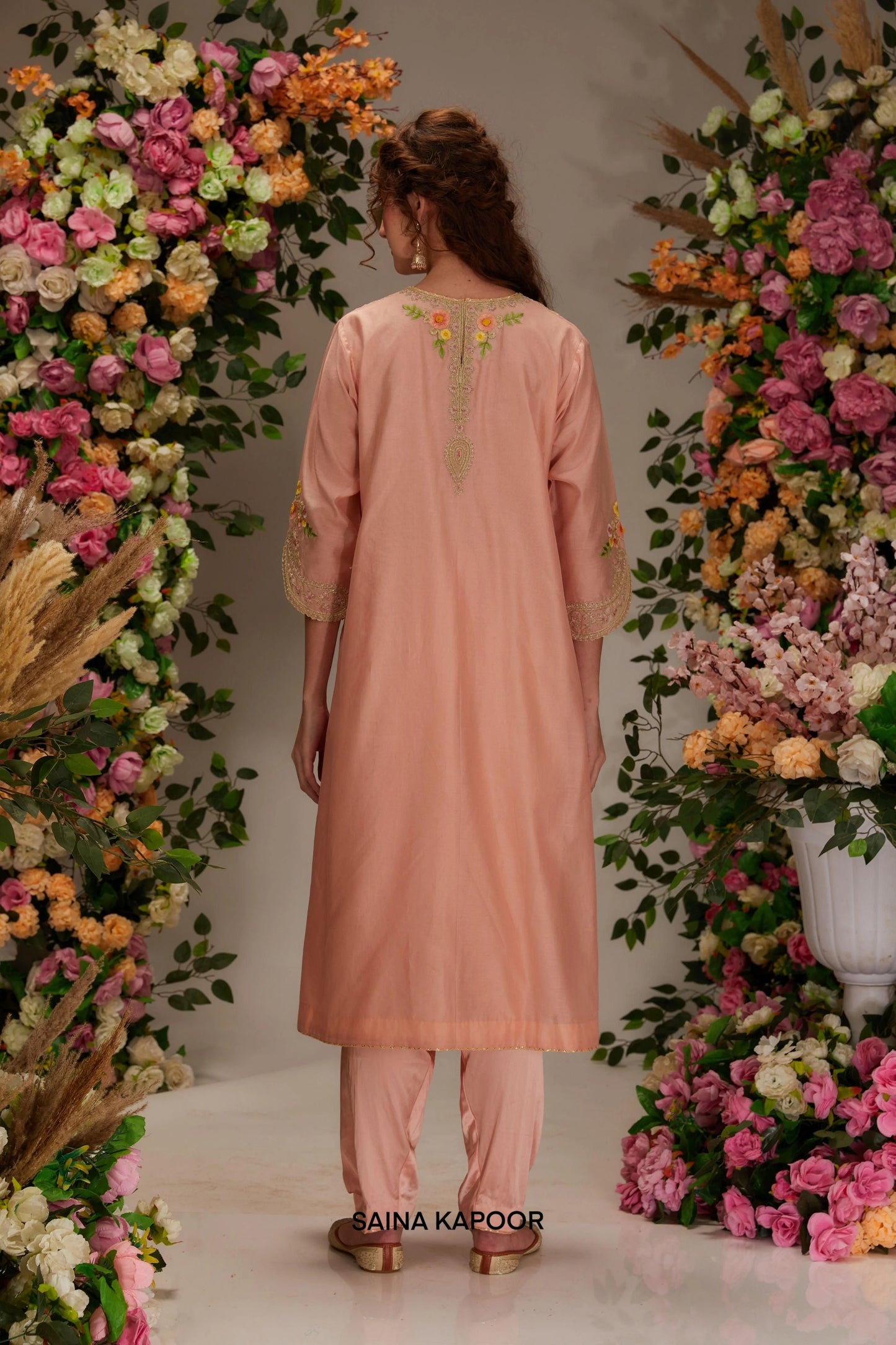 Back view of peach Chanderi long A-line kurta set for women with flowing silhouette & organza dupatta — Saina Kapoor