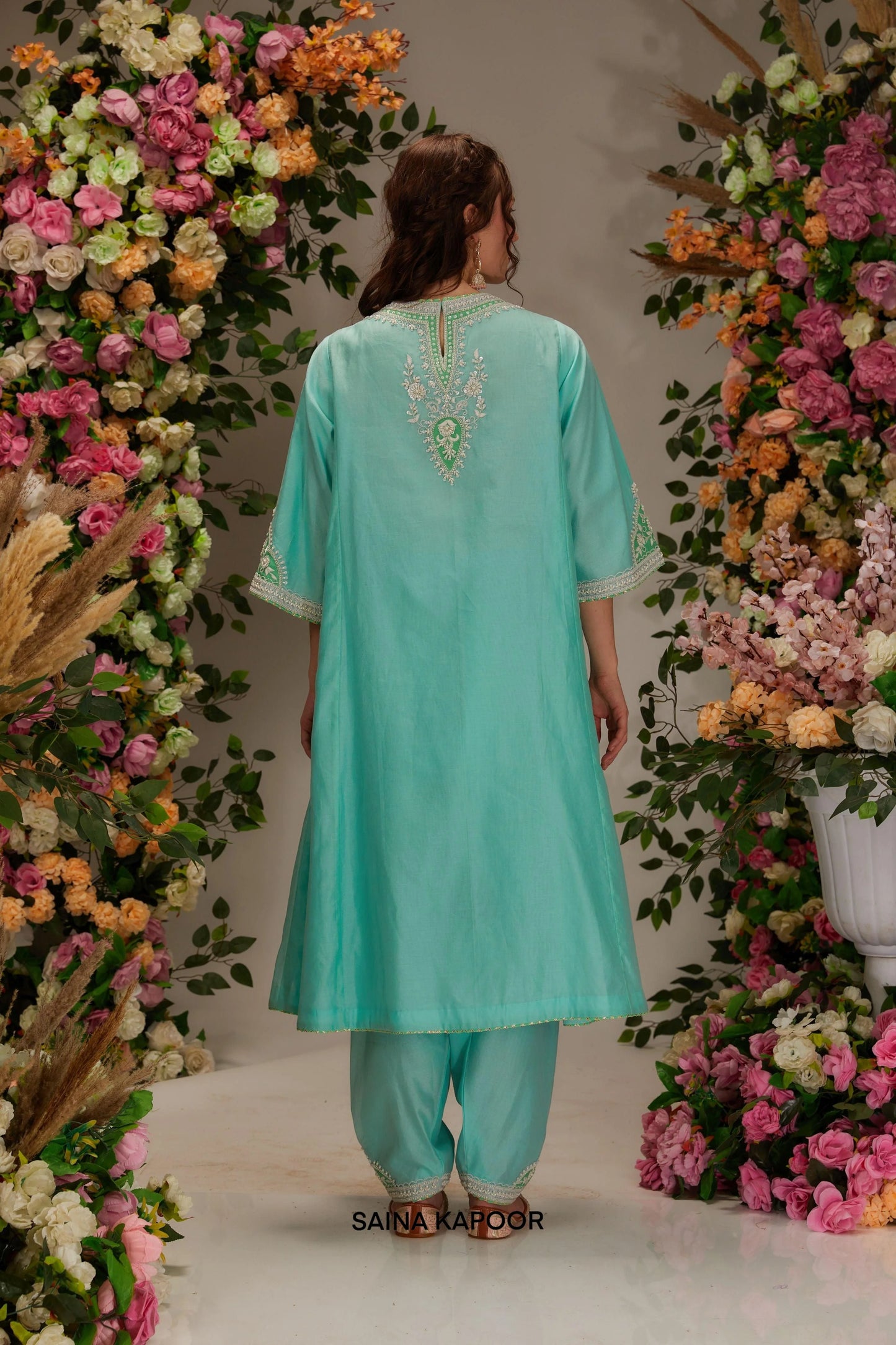 Back view of aqua Chanderi long kalidar kurta set with elongated silhouette & green organza dupatta — Saina Kapoor
