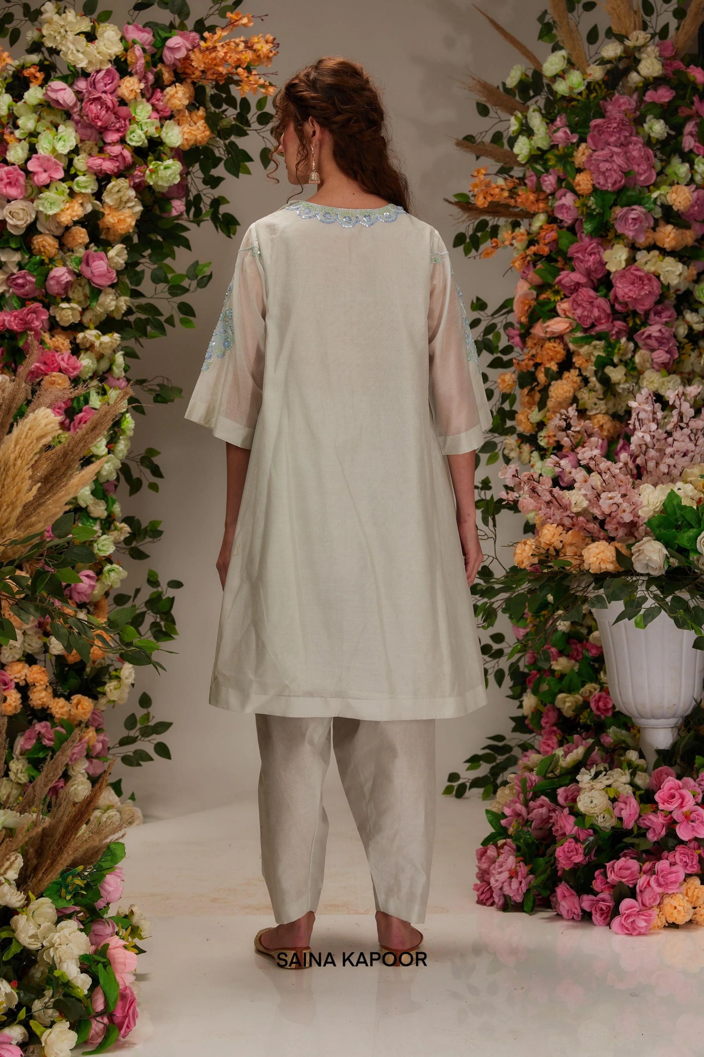 Back view of light grey Chanderi kalidar kurta set with flared silhouette & aqua organza dupatta — Saina Kapoor